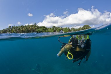 Scuba diver at the surface clipart