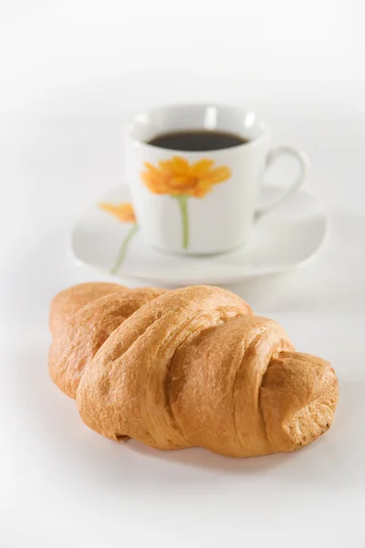 Croissant och kaffe Stockbild