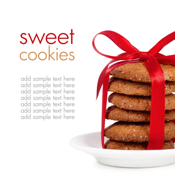Tower of cookies tied with red ribbon on white background space for text — Stock Photo, Image