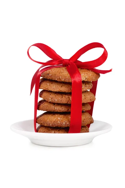 Tower of cookies tied with red ribbon on white background — Stock Photo, Image