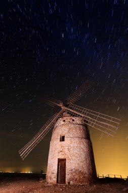 Typical windmill surrounded of stars in Castilla la Mancha, Spai clipart