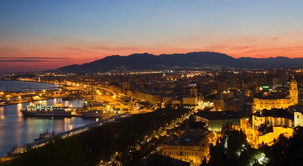 Paysage urbain de Malaga au coucher du soleil Images De Stock Libres De Droits