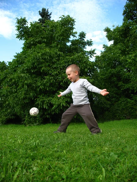 stock image Little boy play football