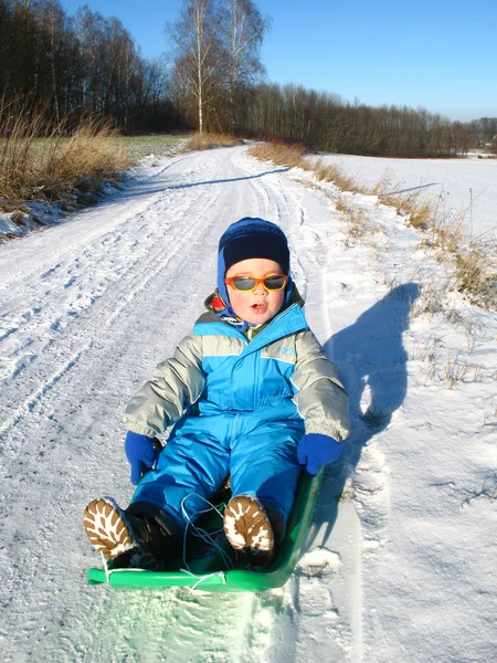 Little boy on the snow Stock Picture
