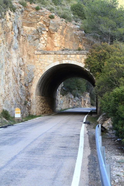 stock image Stone tunnel at mountain road