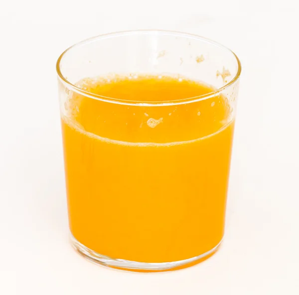 Vista lateral do suco de laranja — Fotografia de Stock