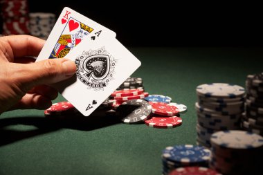 Blackjack hand of cards and casino chips clipart