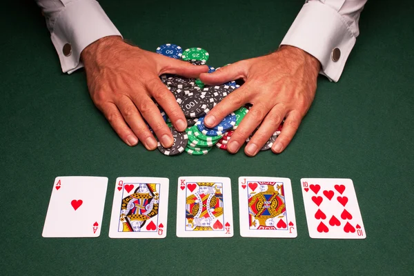 Poker Hand Royal Flush Gewinn Stockbild