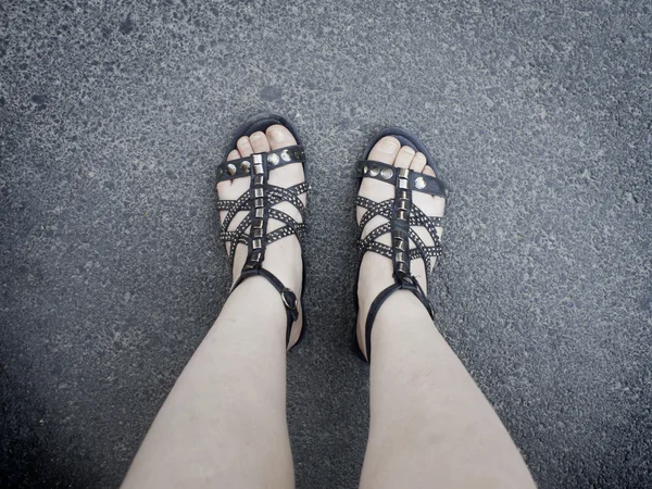 Feet in sandals — Stock Photo, Image