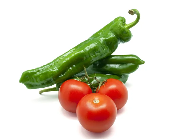 Green peppers with tomatoes — Stock Photo, Image