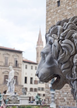 Sculpture in the foreground of a lion clipart