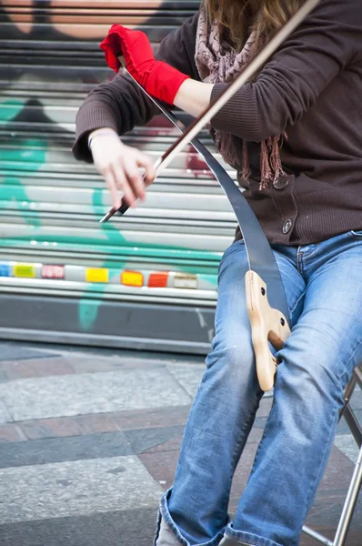 Playing an instrument in the street — Stok fotoğraf