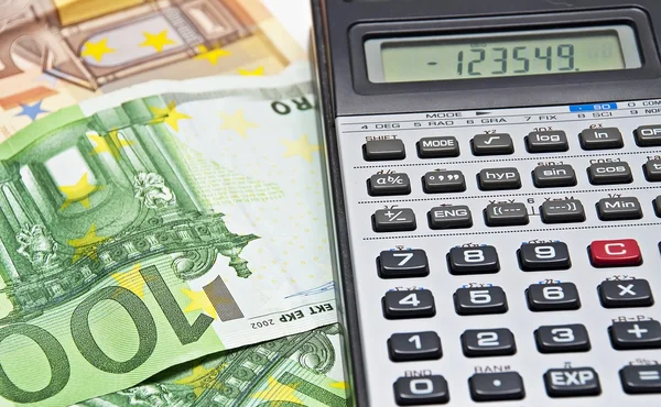 Money and calculator Stock Image