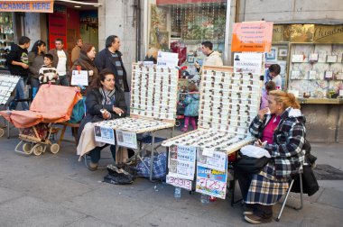 Women selling lottery tickets in Madrid for the draw held in December 22 clipart