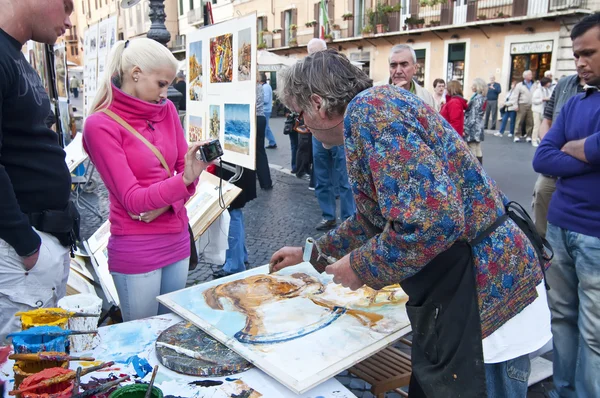 Målare arbetar på piazza navona, Rom — Stockfoto