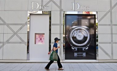 A woman walking the streets of Ginza, Japan clipart