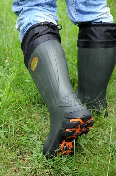 Male feet in rubber boots Stock Picture