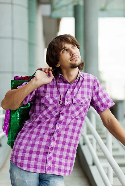 stock image Beautiful young man after shopping. Outdoor shot