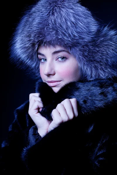 Beautiful young girl in fur clothes. Studio shot — Stock Photo, Image