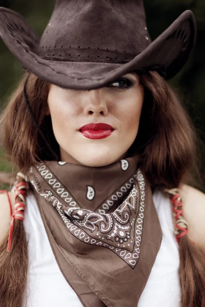 Beautiful cowgirl. Shot in the stable — Stock Photo, Image