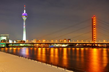 Beautiful night shore of Rhein river at night in Dusseldorf with clipart