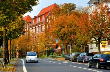 Autumn street with cars in Fulda, Hessen, Germany clipart