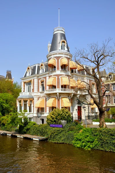 stock image Beautiful river with boats in Amsterdam, Holland (Netherlands)