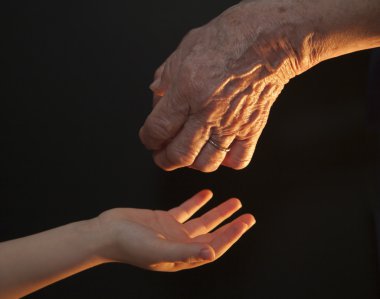 Hands of grandmother and grandchild clipart