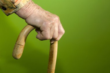 Hand of senior with the staff clipart