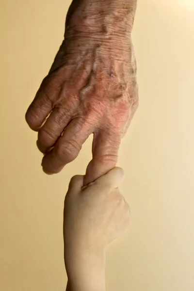 Hand of grandmother and grandchild — Stock Photo, Image
