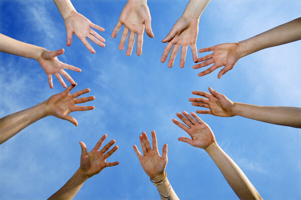 Hands of team and the sky