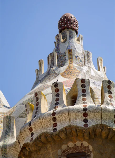 stock image BARCELONA - JUN 2009: mosaic rooof of house in Park Guell, designed by Antoni Gaudi. Built in 1900 - 1914. Part of UNESCO, Jun 9,2009 in Barcelona Spain.