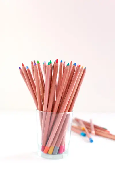 stock image Colored pencils in the glass