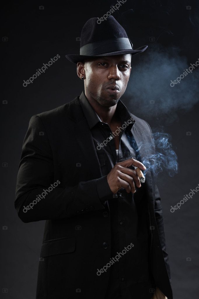 black man in suit and hat