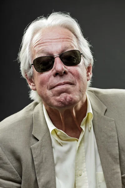 Senior business man wearing light suit with black sunglasses. — Stock Photo, Image