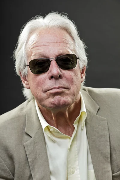 Senior business man wearing light suit and black sunglasses. — Stock Photo, Image
