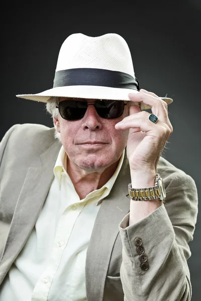 Senior gangster man wearing light suit and hat with black sunglasses. — Stock Photo, Image