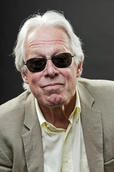 Senior business man wearing black sunglasses and light suit. — Stock Photo, Image