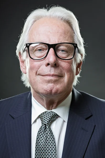 Senior man with vintage glasses in suit — Stock Photo, Image
