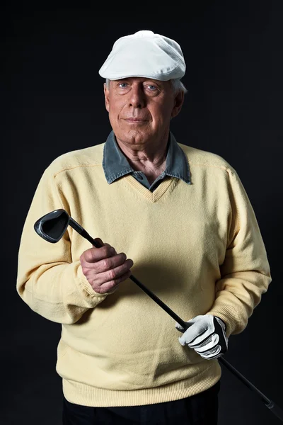 stock image Studio portrait of senior golf man.