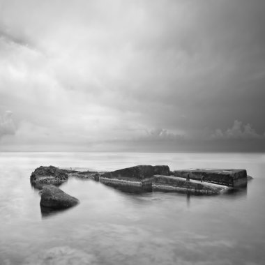 Black & White minimalist seascape with rocks clipart