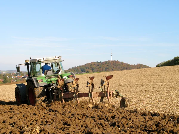 Stock image Brown Acre with Tractor