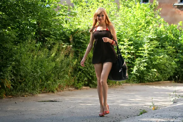 stock image Young girl on road