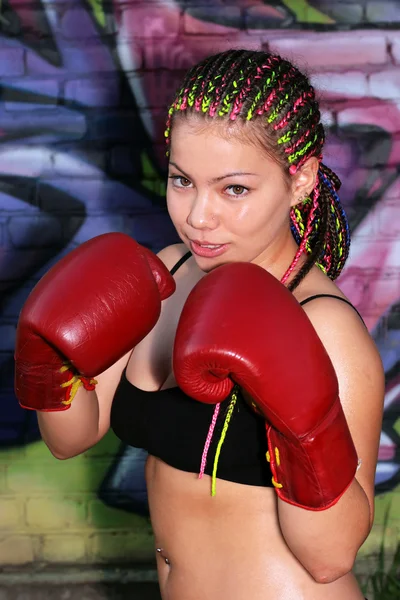 Portrait of a girl with red boxing gloves — Stock Photo, Image
