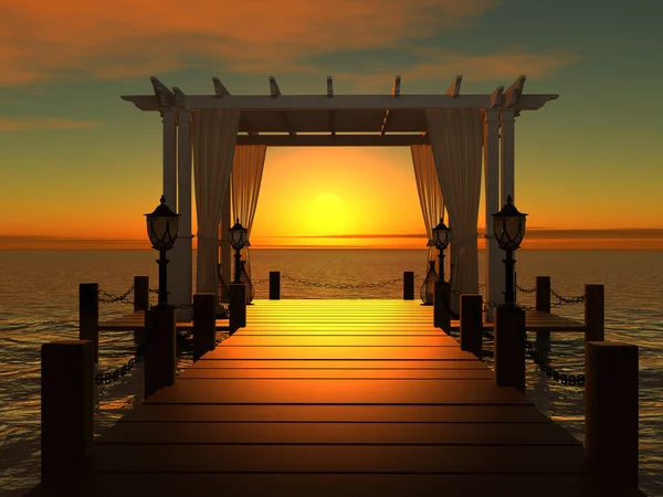 Hochzeitspavillon auf dem hölzernen Steg ins Meer mit der Sonne bei Sonnenuntergang Stockfoto