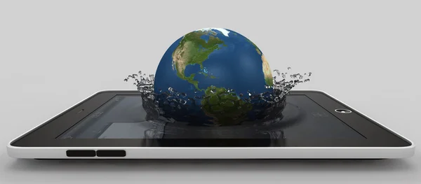 Globe falling with splashes into the device 's screen — стоковое фото