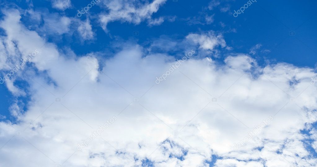 Blue sky with a huge white cloud