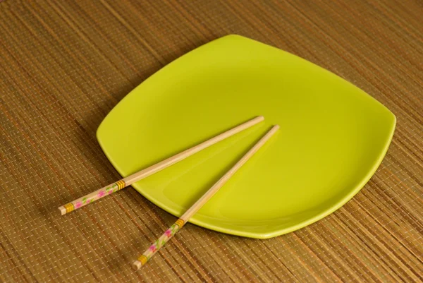 Chopsticks in the square plate — Stock Photo, Image