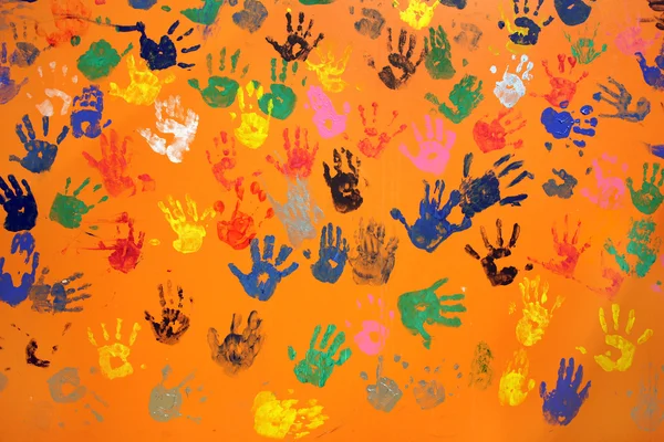 Multiple colored hand prints — Stock Photo, Image