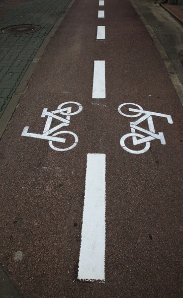 Sign on tarmac bicycle path — Stock Photo, Image